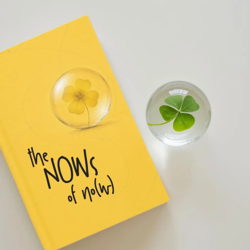 The Nows of No(w) book by Pa3 besides her signature clover sphere